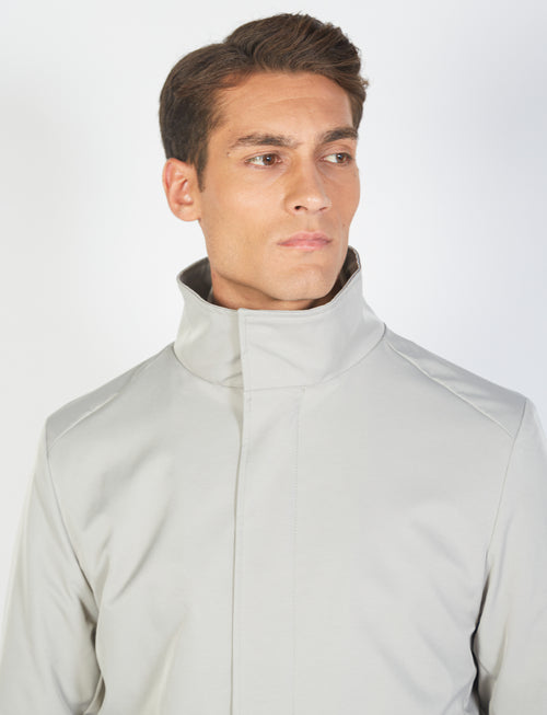 Coat with bib in technical fabric 